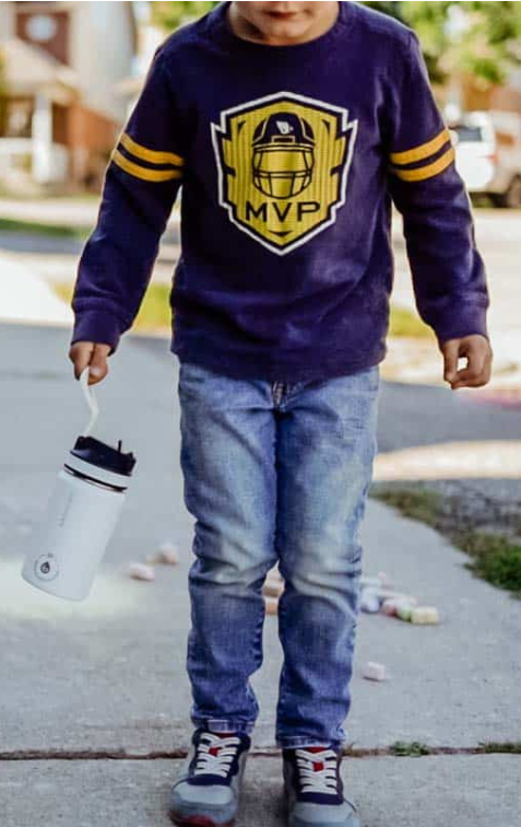 little boy with Lil Chill water bottle
