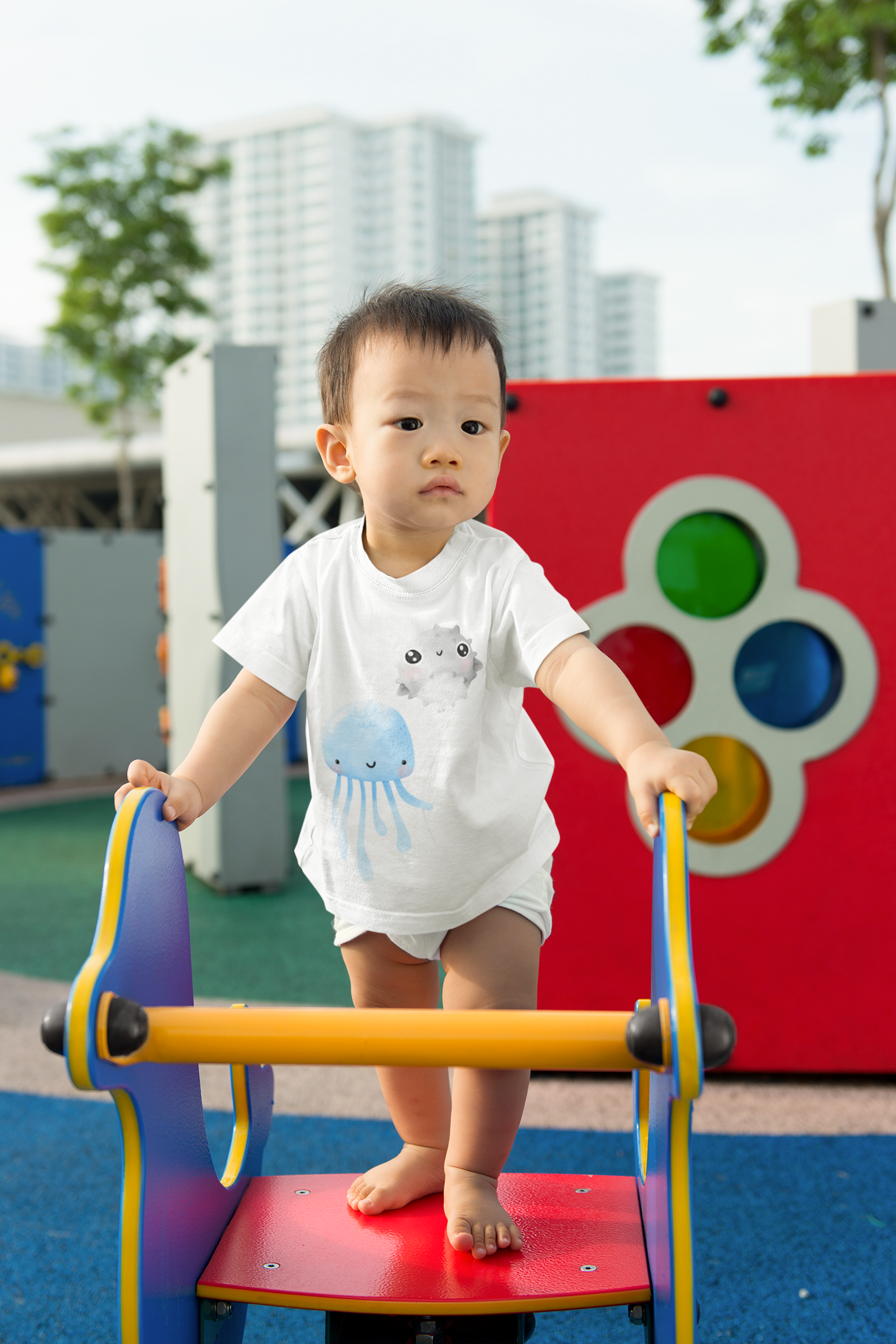 Baby wearing blue jellyfish tee
