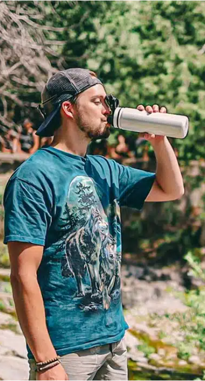 Man drinking from grosche infusion water bottle