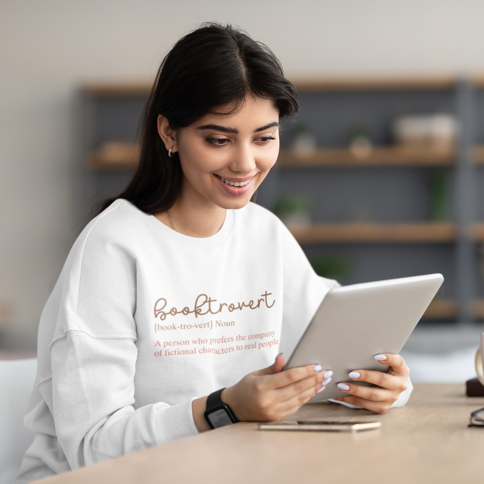 mock up of a person wearing a booktrovert definition sweatshirt